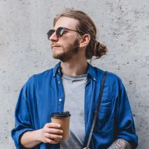 portrait of cheerful young caucasian man holding c 2023 11 27 05 18 35 utc 2